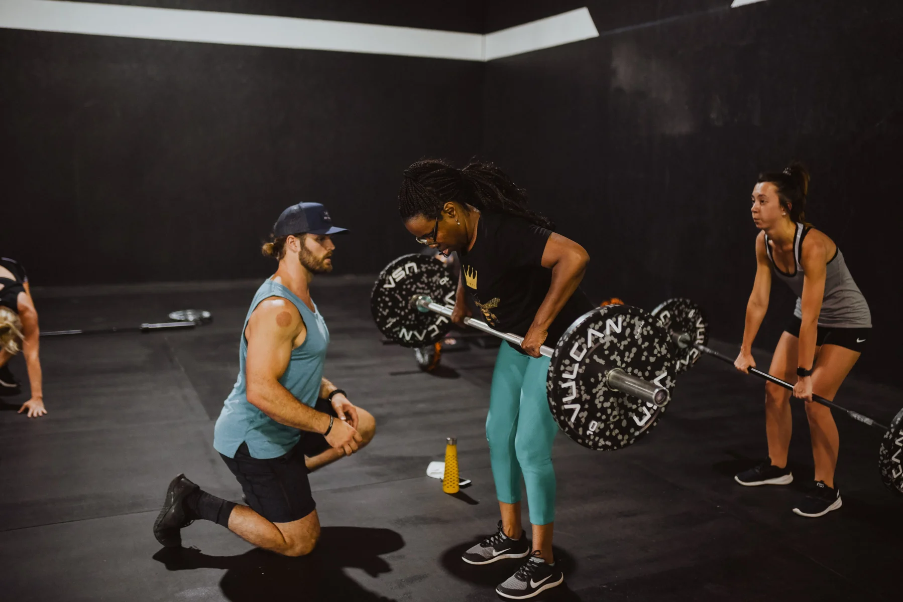 Deep River Fit athletes training on the gym floor.